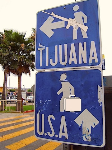 Pedestrian_border_crossing_sign_Tijuana_Mexico.jpg