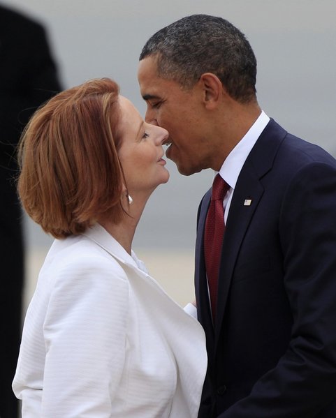 191267-u-s-president-obama-kisses-australian-prime-minister-gillard-as-he-arr.jpg