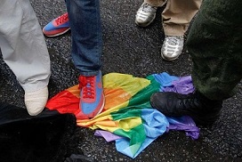 anti-gay-activists-stepping-on-a-rainbow-flag-via-Reuters.jpg