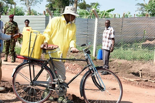 President Yoweri Kaguta Museveni fetching water with his bicycle.jpg