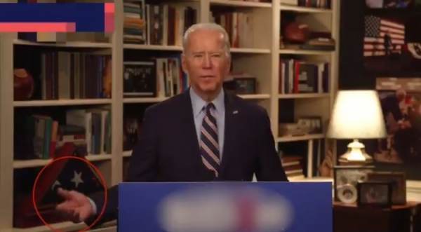 Joe Biden signaling for help.jpg