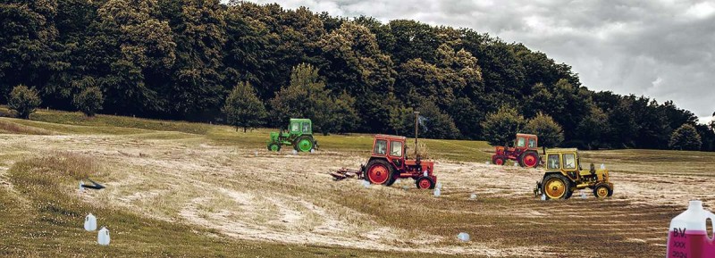 A MENACING PRESENCE of still more tractors disrupts the tranquility of a pastoral Texazistan field for a tense third day.