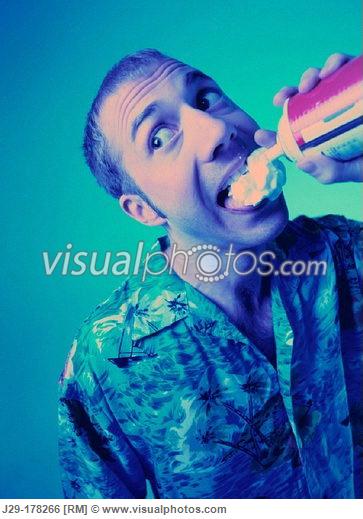 man_eating_whipped_cream_J29-178266[1].jpg