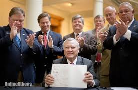 deal signs bill.jpg