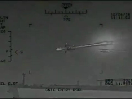 Iranian boat being fired upon.jpg