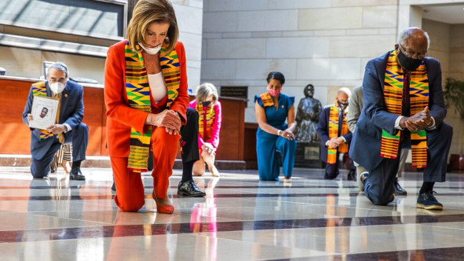 Nancy Pelosi kneeling.jpg