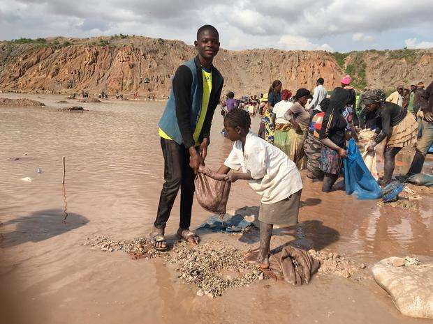 Children are seen washing cobal.jpg