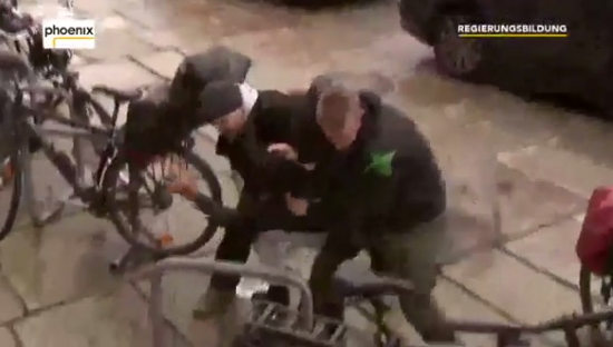 Man runs at Merkel.jpg